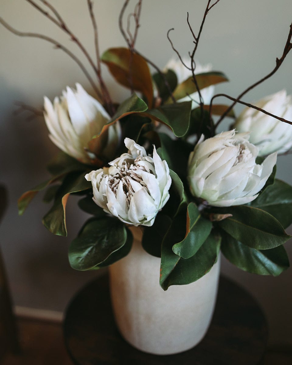 Green Faux Magnolia Leaves Styled with King Protea Blooms